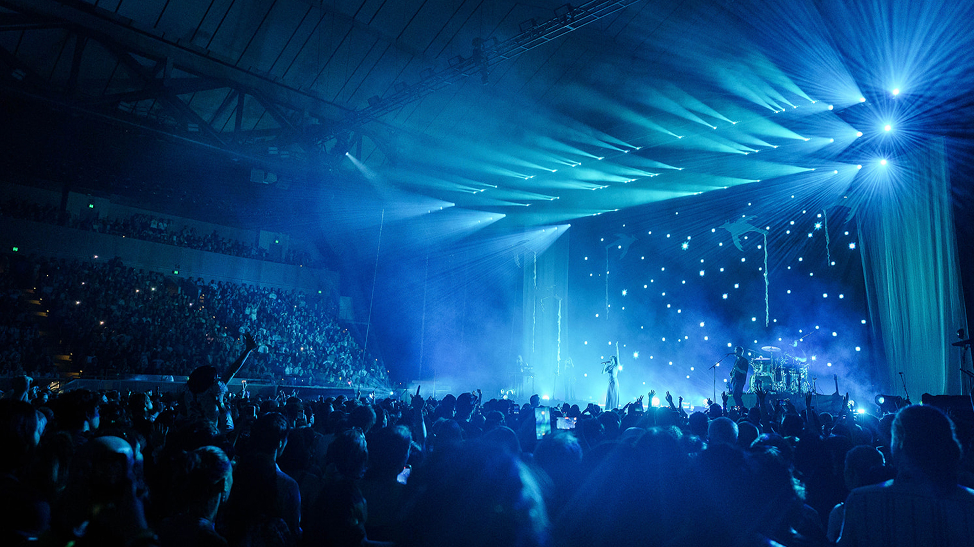 A packed crowd enjoying a concert at Margaret Court Arena.
