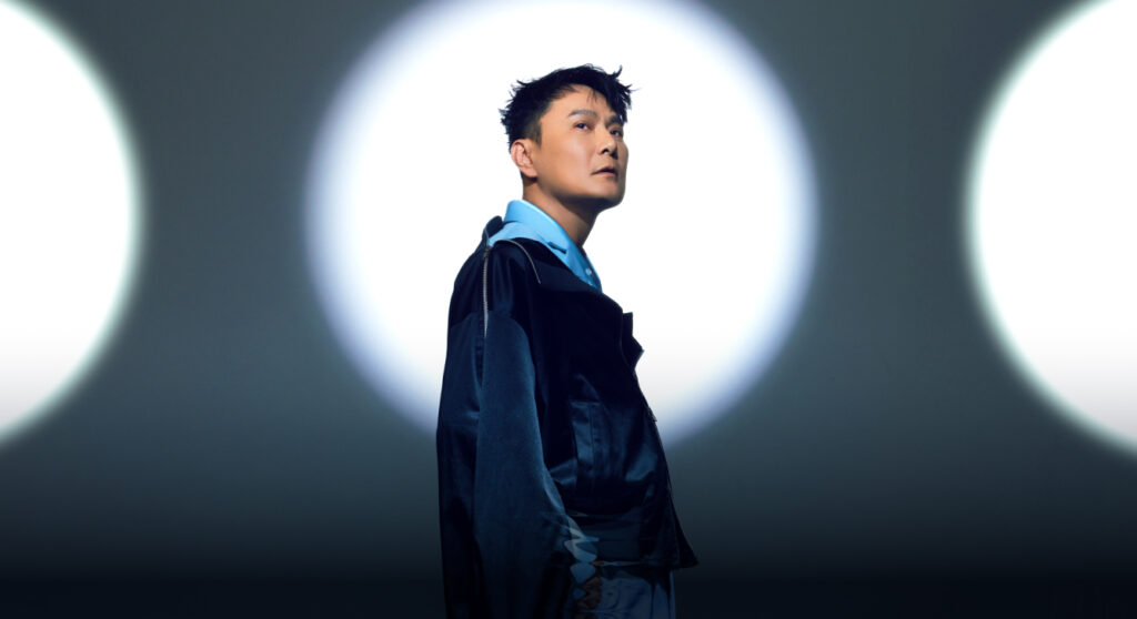 Singer Jeff Chang posing against a circular background.