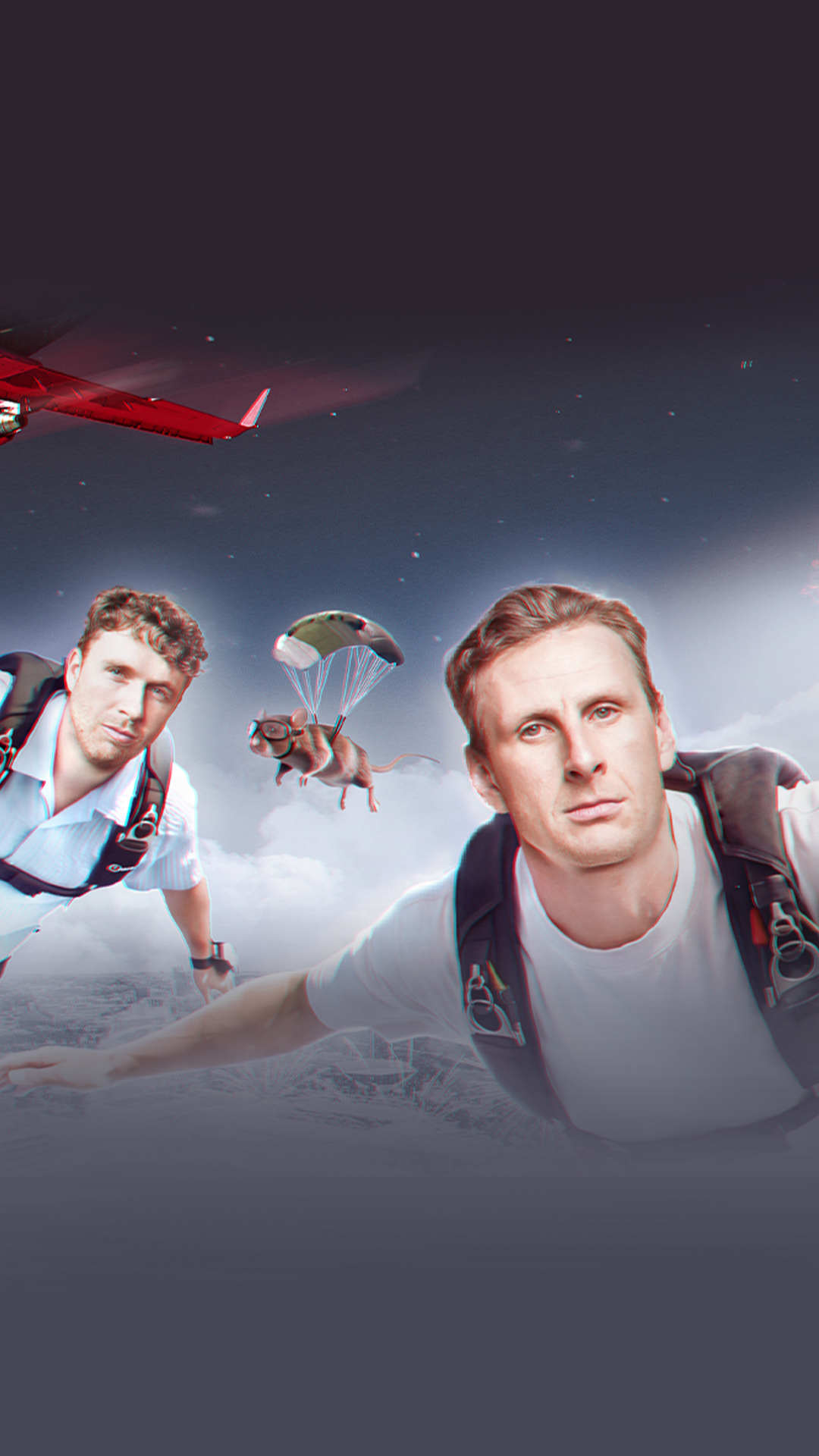Two men pose together in front of a bright red plane, smiling at the camera.