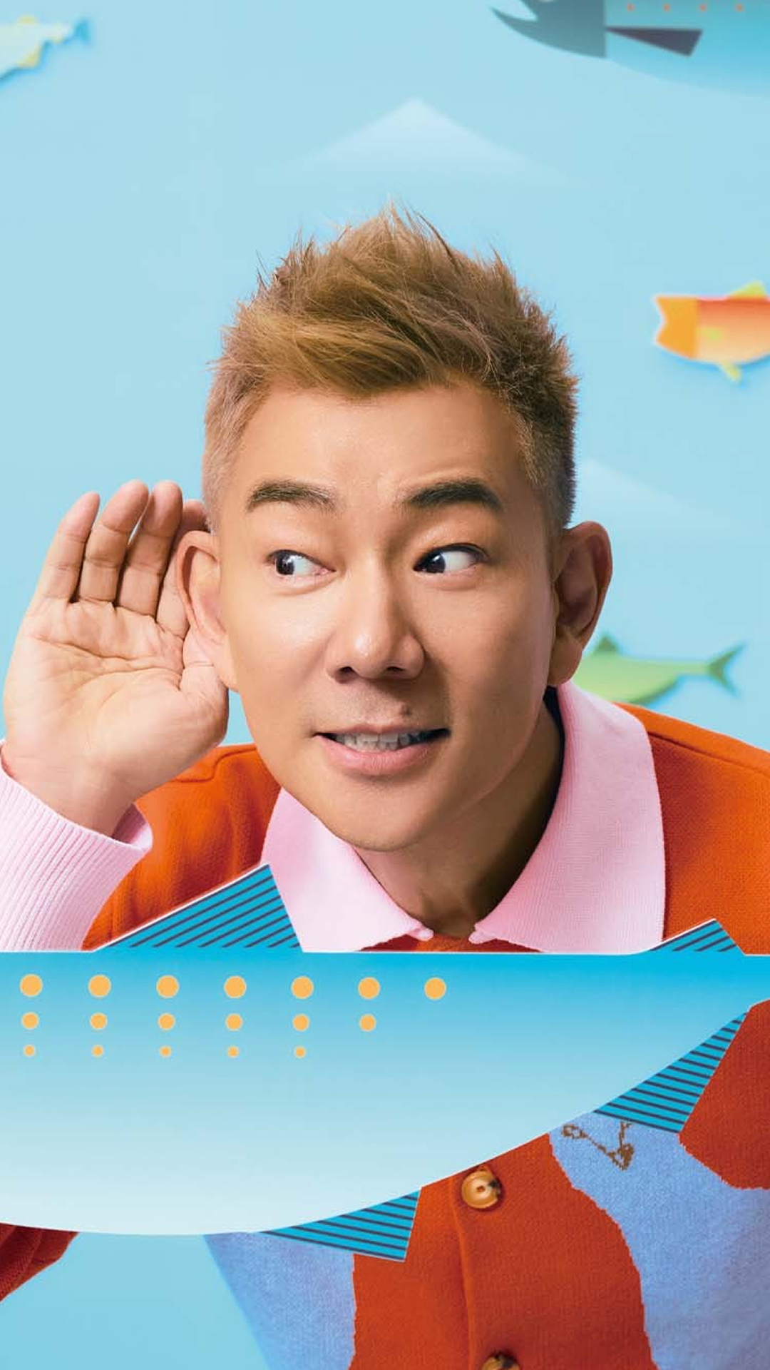 Richie Jen jumps in the air surrounded by flying fish.